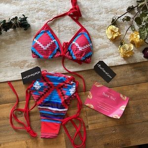 One Twelve Swim. Brand new. Small. Two piece bathing suit. Blue and red.